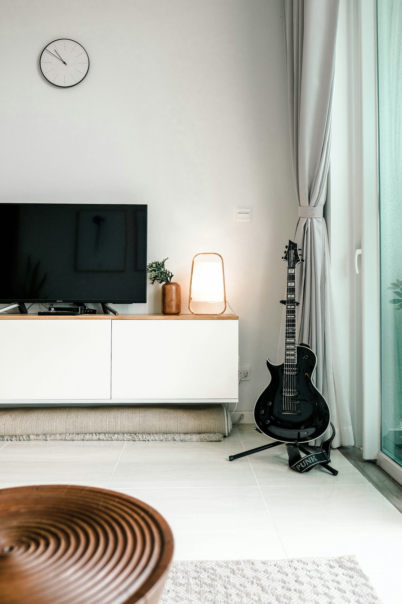 Windows, lighting, and electronics are part of the room you should discuss when reviewing controls. Neither compared thermostat is pictured.